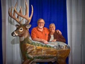 Glenn and Judy Helgeland of Target Communications received recognition in 2009 from the Alliant Energy Center of Dane County in Madison, Wisconsin for 25 years of producing the Wisconsin Deer & Turkey Expo at that facility. It is the third largest expo held at that site, and the largest deer & turkey expo in the U.S. The colorful deer sculpture is positioned atop a pylon in the main concourse of the Exhibition Building, with this photo posted on a plaque below the deer. The sculpture has a farm scene painted on one side and a forest scene on the other side.